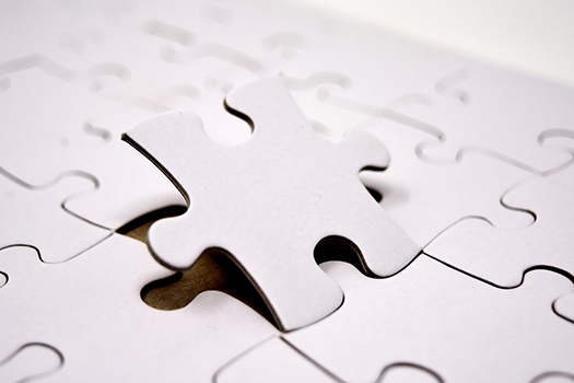 Puzzle piece being inserted into it's corresponding spot